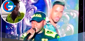 Policía canta junto a Romeo Santos en concierto